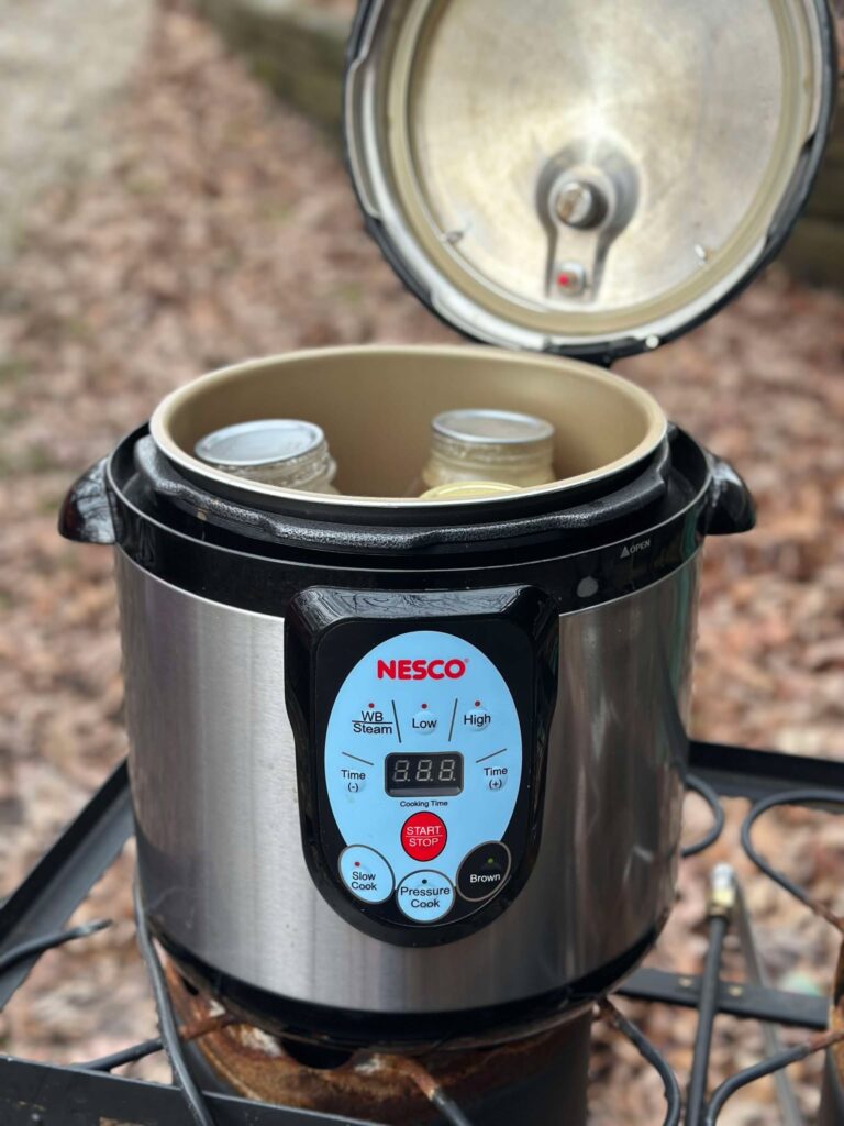 Nesco Electric Pressure Canner with jars inside