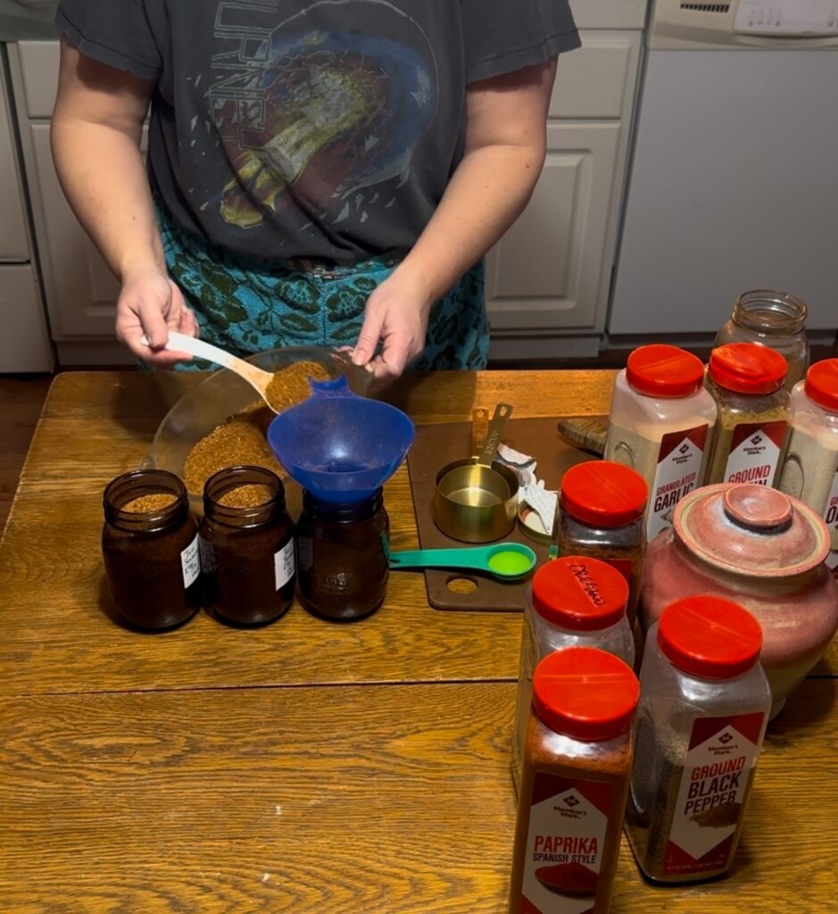adding taco seasoning to canning jars